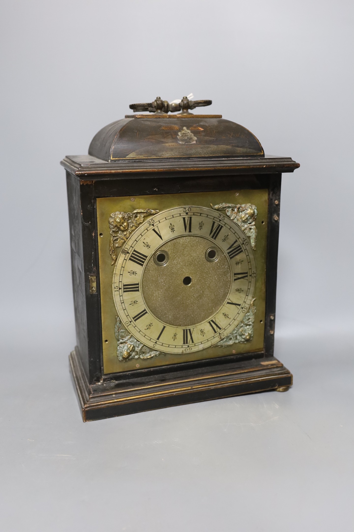 A Chinoiserie mantel clock in need of restoration, 35 cms high.